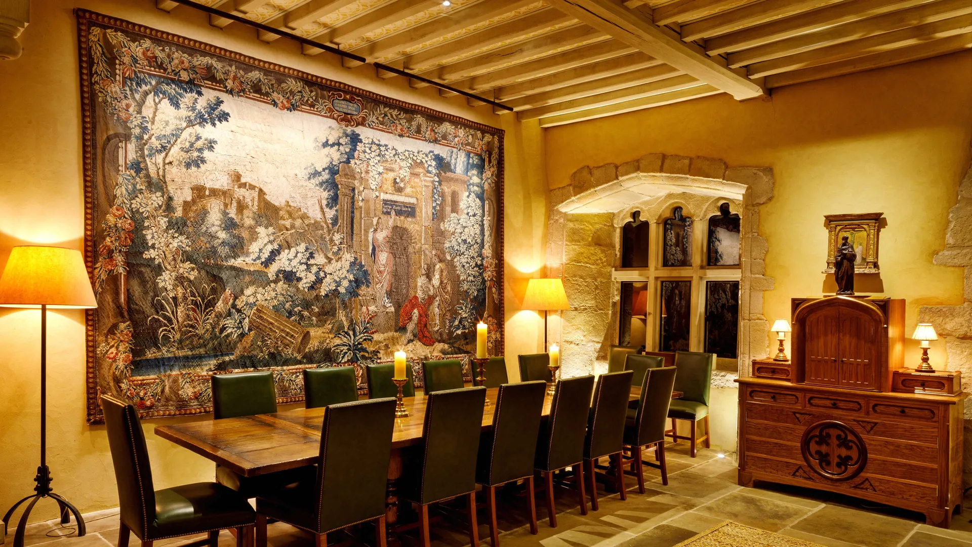 A fine art collection on a fabric wall lit with a bespoke ArtView picture light array from a customised powered hanging rail.
