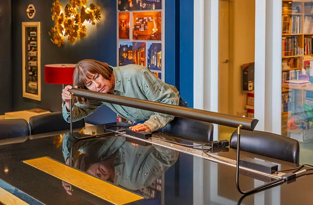 Melanie Shaw, Design Director, testing an ArtView II picture light