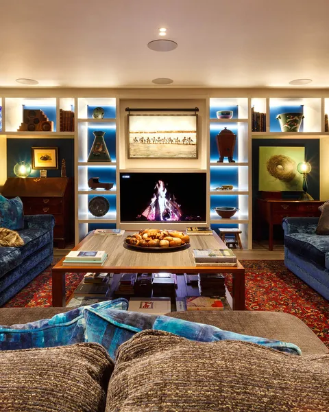 A brightly-lit luxurious living room in a modern city centre townhouse