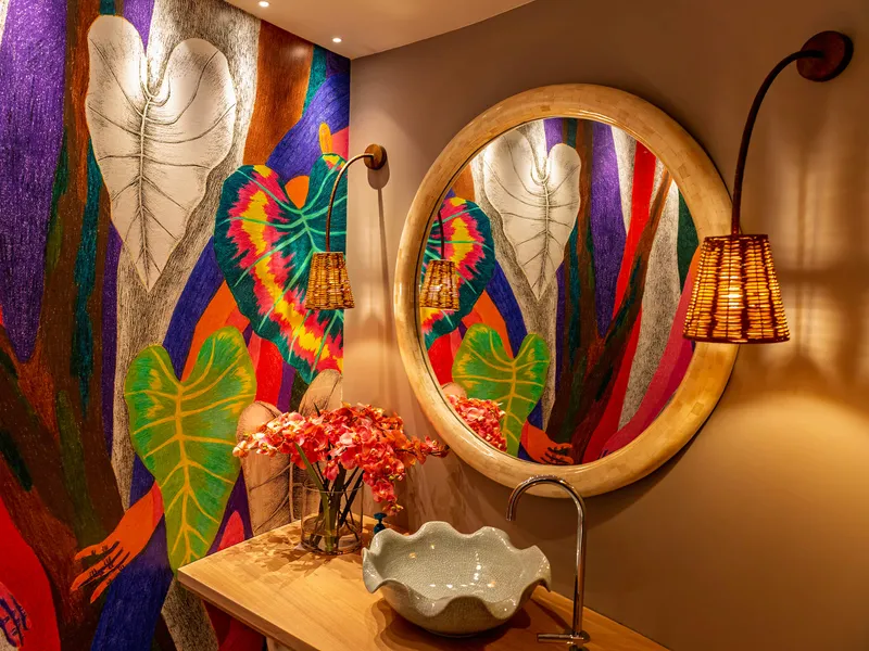 Miniature LED downlights and decorative wall lights in a brightly lit and vibrant bathroom