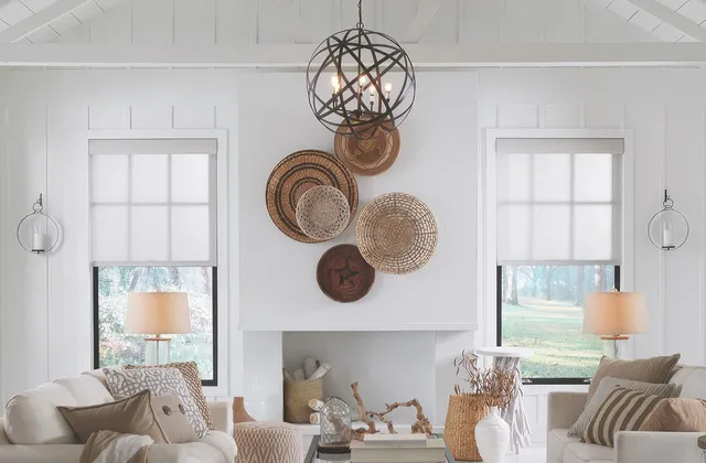 Lutron Triathalon roller blinds in a bright, airy living room