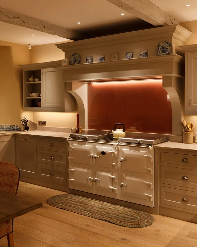 Traditional kitchen aga lit with linear LED lighting